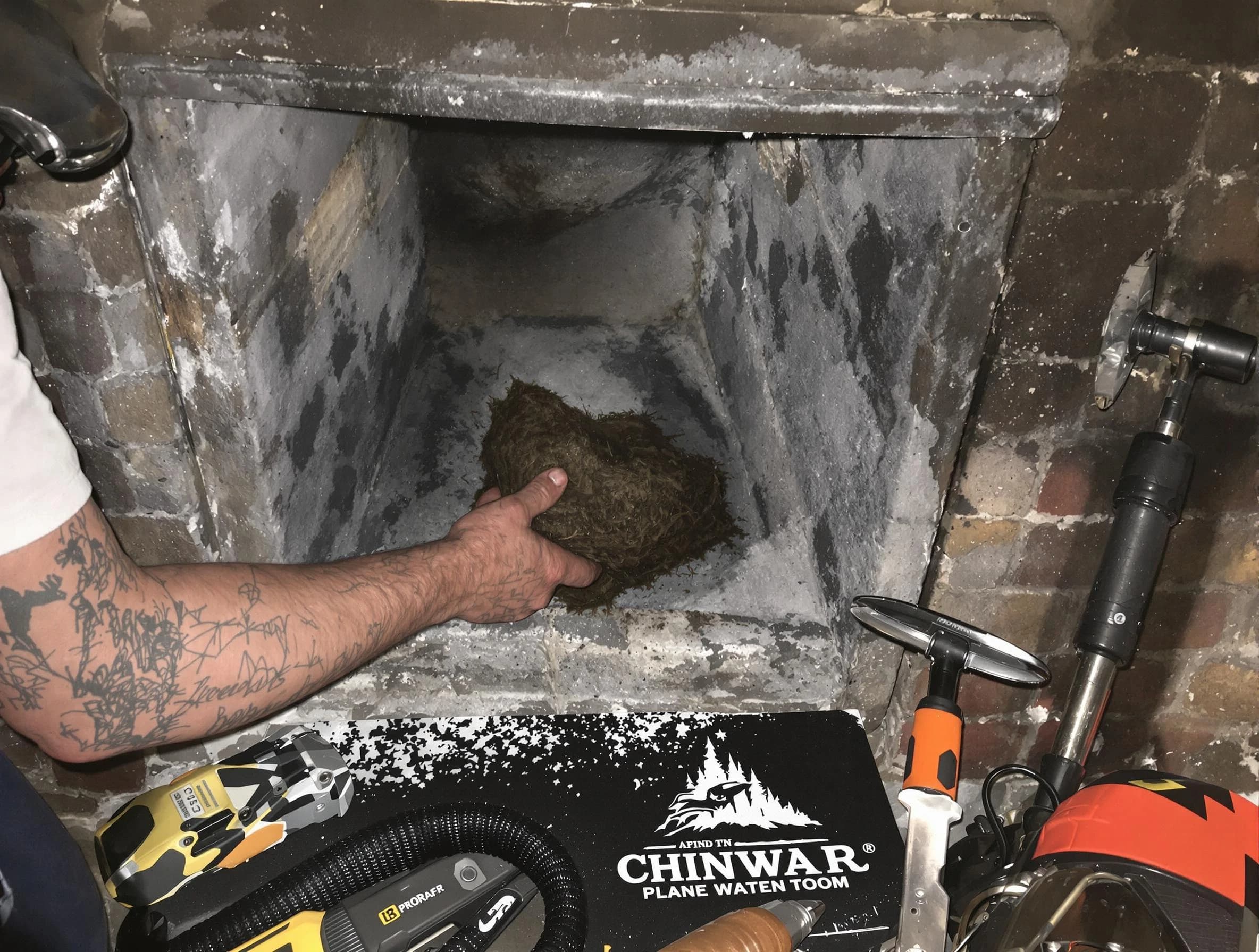 Penn Hills Chimney Sweep safely removing debris and screening chimney in Penn Hills, PA
